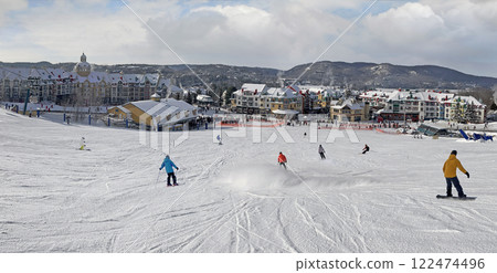 Skiers enjoying the aerial view of Mont Tremblant resort, Quebec, Canada 122474496