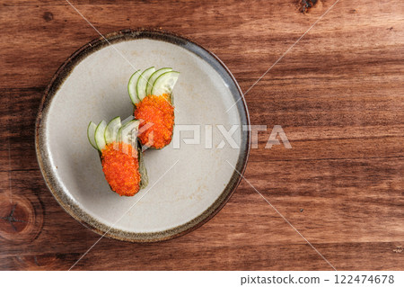 Fish Roe and Cucumber Gunkan Sushi Served on a Plate 122474678