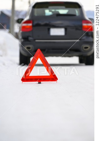 Broken down car and stop triangle Broken down car and stop triangle 122475291