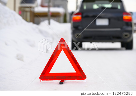 Broken down car and stop triangle 122475293