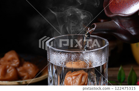 Shochu with plum Shochu with plum 122475315