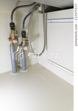 Leaking faucet (actual view under the sink) 122475577