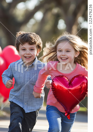 Children Running in Park with Valentine Themed Heart Balloons and Joyful Expressions 122476236