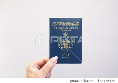 Passport Jordan Held Against Simple White Background. Astana, Kazakhstan, 26 october 2024 122476479