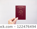 Luxembourg Passport Held Against Simple White Background. Astana, Kazakhstan, 26 october 2024 122476494