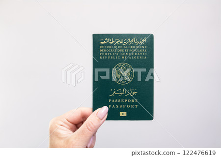 Passport Algeria Held Against Simple White Background. Astana, Kazakhstan, 26 october 2024 Passport Algeria Held Against Simple White Background. Astana, Kazakhstan, 26 october 2024 122476619