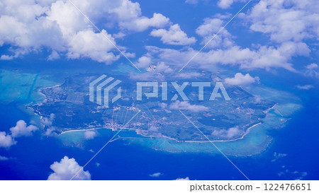 The coastline seen through a sea of clouds from an airplane 122476651