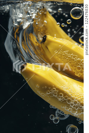 AI-generated image of a banana surrounded by bubbles bursting underwater 122476830