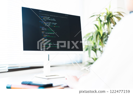 Young woman programming in Python, no face Young woman programming in Python, no face 122477159