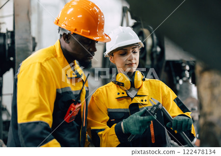professional engineer team checking product quality control in metal workshop production line professional engineer team checking product quality control in metal workshop production line 122478134