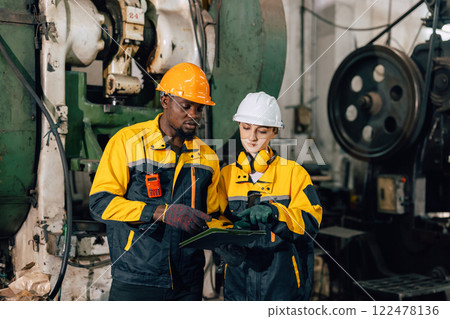 professional engineer team inspecting service machine in heavy industry factory professional engineer team inspecting service machine in heavy industry factory 122478136