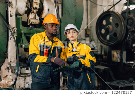 professional engineer team inspecting service machine in heavy industry factory professional engineer team inspecting service machine in heavy industry factory 122478137