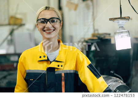 portrait professional worker working in heavy metal industry factory happy smiling enjoy working 122478153