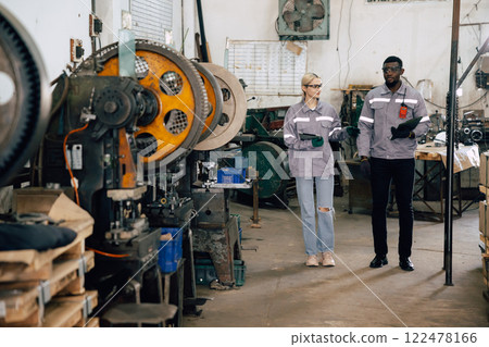 professional engineer officer team inspecting safety audit old machine in heavy industry factory 122478166