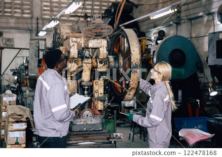professional engineer officer team inspecting safety audit old machine in heavy industry factory 122478168
