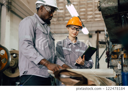 professional engineer worker team working for plant renovate with floorplan building talking 122478184