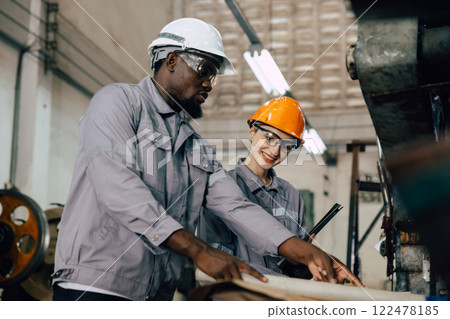 professional engineer worker team working for plant renovate with floorplan building talking 122478185