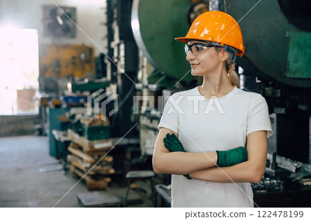 portrait professional worker working in heavy metal industry factory look away proud success 122478199