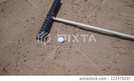 Sand pit with sanding equipment in golf course sand bunker. 122478207