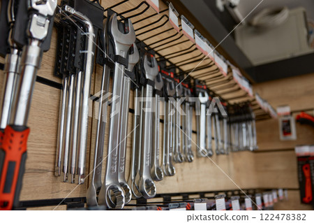 Displayed tools panel rack with wrenches, spanners and hydraulic jacks 122478382