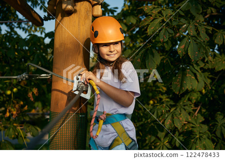 Steel wire rope slings in hand of little girl climbing Steel wire rope slings in hand of little girl climbing 122478433