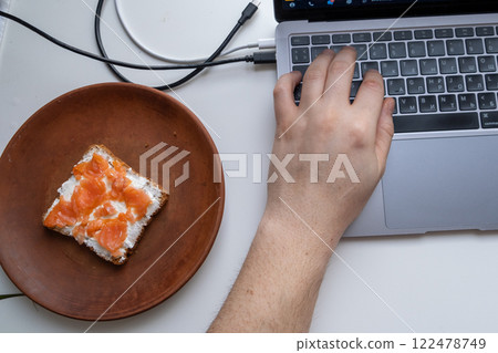 Minimalist Workspace with Laptop and Breakfast 122478749