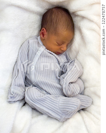 Newborn Baby Sleeping in Cozy Blanket Newborn Baby Sleeping in Cozy Blanket 122478757