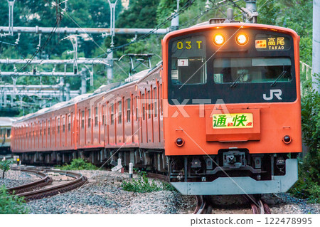 Chuo Line Commuter Rapid 201 Series trains run only on weekday evenings Chuo Line Commuter Rapid 201 Series trains run only on weekday evenings 122478995