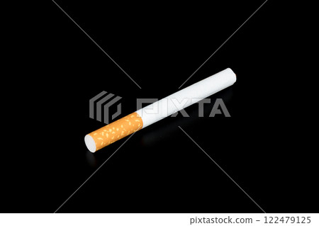 Cigarette butts isolated on black background 122479125