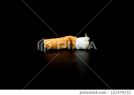 Cigarette butts isolated on black background Cigarette butts isolated on black background 122479132
