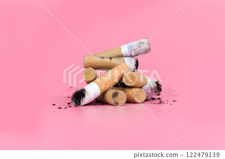 Cigarette butts isolated on pink background 122479139