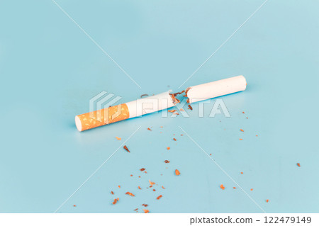 Cigarette butts isolated on blue background Cigarette butts isolated on blue background 122479149