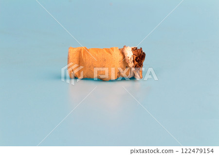Cigarette butts isolated on blue background Cigarette butts isolated on blue background 122479154