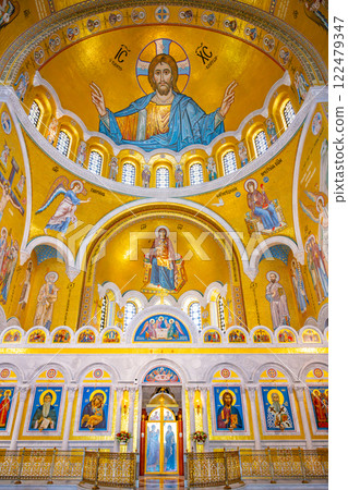 Stunning details of the Church of Saint Sava showcase golden domes, intricate frescoes, and religious icons. The interior reflects the architectural beauty of Serbian Orthodox traditions. 122479347