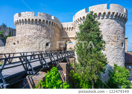 Zindan Gate is an impressive stone structure within Belgrade Fortress, showcasing medieval architecture and greenery against a bright blue sky. It's a must-see historical site in Serbia. Zindan Gate is an impressive stone structure within Belgrade Fortress, showcasing medieval architecture and greenery against a bright blue sky. It's a must-see historical site in Serbia. 122479349