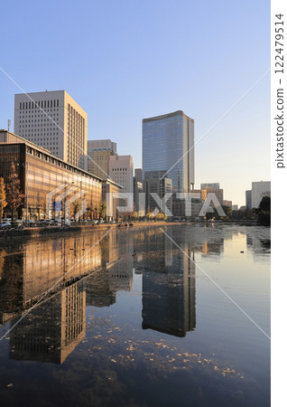 Marunouchi at dusk, seen from the Babasakimon Gate in the outer gardens of the Imperial Palace across the Hibiya Moat Marunouchi at dusk, seen from the Babasakimon Gate in the outer gardens of the Imperial Palace across the Hibiya Moat 122479514