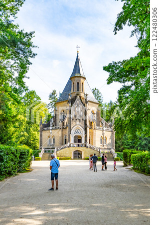 Visitors admire the stunning Schwarzenberg Tomb located in Domanin near Trebon, Czechia. This architectural gem is surrounded by lush greenery, creating a serene atmosphere. 122480306