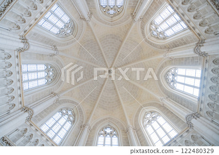 This breathtaking interior features intricate architectural details and elegant stained glass windows. It invites visitors to appreciate its historical significance and artistry in Domanin, Czechia. 122480329