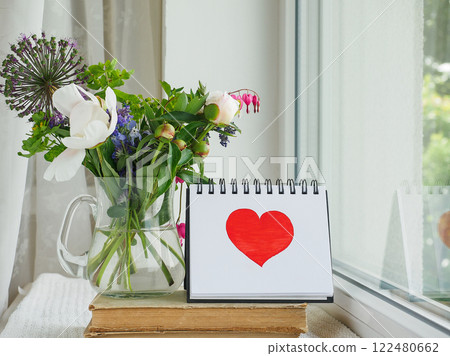 Bouquet of bright flowers standing in a vase 122480662