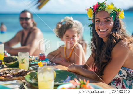 Happy family enjoys a festive luau party on a sunny beach, radiating joy and togetherness with vibrant tropical attire 122480940