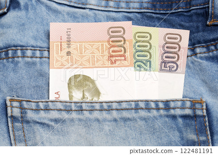 Angolan Kwanza in the pocket of blue jeans Angolan Kwanza in the pocket of blue jeans 122481191