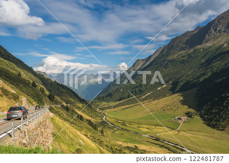 Cars drive at Susten Pass road in the Swiss Alps, Canton of Uri, Switzerland Cars drive at Susten Pass road in the Swiss Alps, Canton of Uri, Switzerland 122481787
