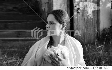 Young girl with white flowers Young girl with white flowers 122481883