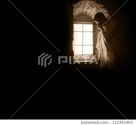 Ancient man at the old wondow 122481903