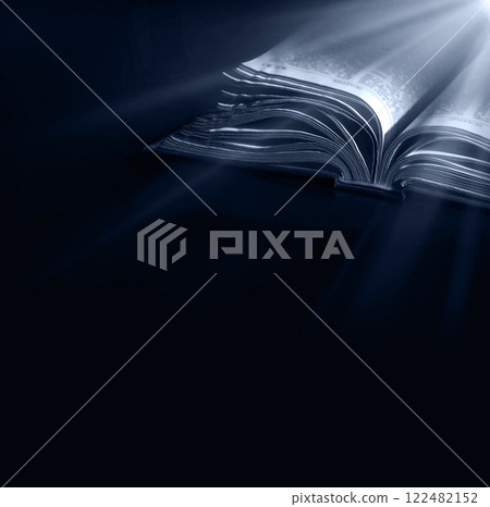 Dark table with open bible 122482152