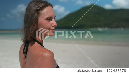 Woman close up portrait enjoy seascape and white sand beach beautiful nature landscape. Relax, outdoor lifestyle travel, summer holiday vacation. Malibu Beach, Koh Phangan tropical Island, Thailand. Woman close up portrait enjoy seascape and white sand beach beautiful nature landscape. Relax, outdoor lifestyle travel, summer holiday vacation. Malibu Beach, Koh Phangan tropical Island, Thailand. 122482278