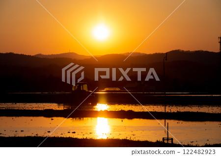 Agricultural work at dusk 122482923