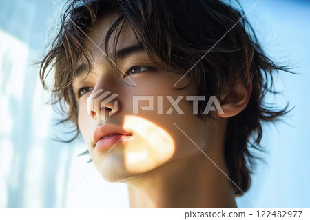 Young Japanese man with a sad expression Young Japanese man with a sad expression 122482977