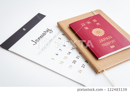 Passport and calendar on white background 122483139