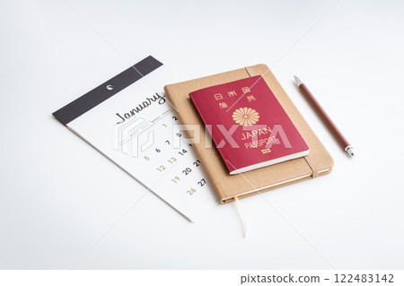 Passport and calendar on white background 122483142